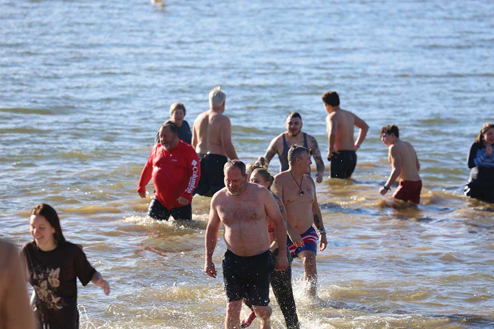 More than 100 plunge into chilly Lake Washington in Kirkland to ring in the  New Year, Photos